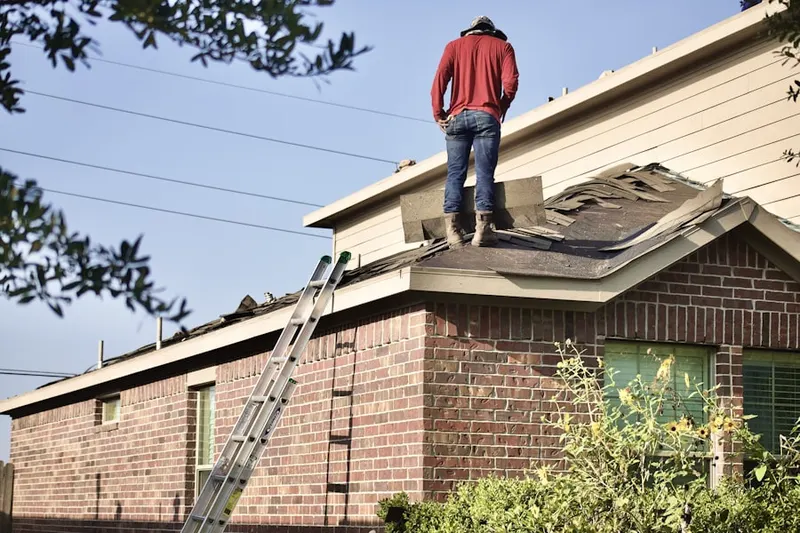 Professional roofer working on a residential roof in Donner Springs